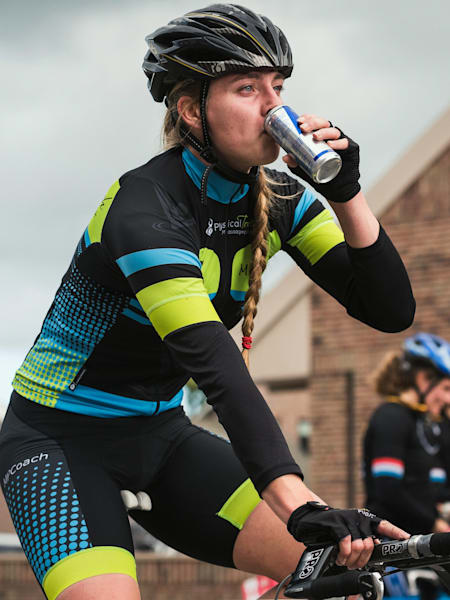 A cyclist fuels during an endurance cycling race