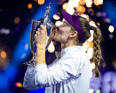 Elena Rybakina celebrates with the WTA Final trophy in Riyadh, Saudi Arabia.