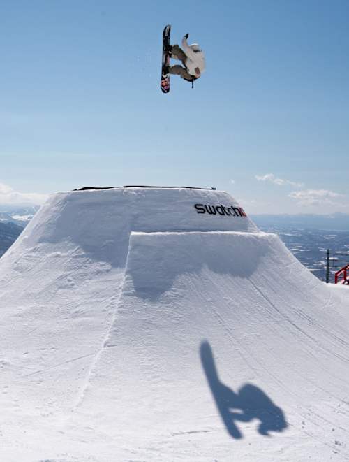 Japanese snowboarder Ryusei Yamada performs an epic aerial trick at Swatch Nines 2026 in Niseko, Japan, set against Yotei's snow-capped peak and clear winter skies