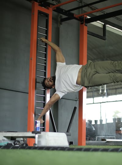 Kochi fitness trainer Nipun Viju performs calisthenics exercises in a gym.