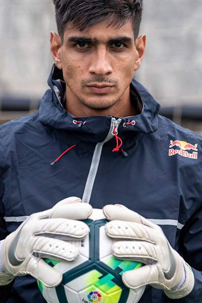 Indian football goalkeeper Gurpreet Singh Sandhu holds a ball during a training session.