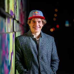 Ziga Lin Hočevar smiles at Red Bull's graffiti wall in 2024.