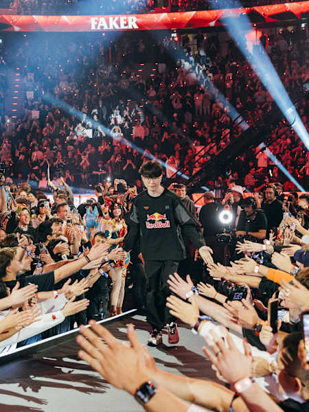 Faker of T1 is surrounded by cheering fans at Red Bull League of Its Own in Munich, energising the esports arena with Red Bull excitement (November 29, 2025)