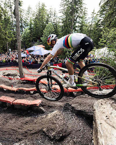 Tom Pidcock competes at the 2024 UCI XCO World Cup mountain bike race in the Swiss Alps forest setting of Crans-Montana
