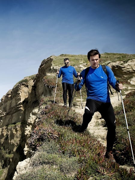 Paraglider Nuno Virgilio and freind hiking at Meco Beach in Lisbon, Portugal on February 26th 2011.