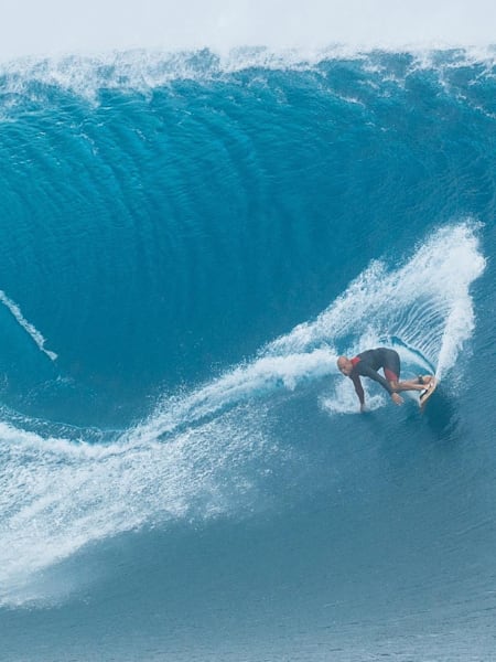 Kelly Slater tow surfing at Cloudbreak Fiji