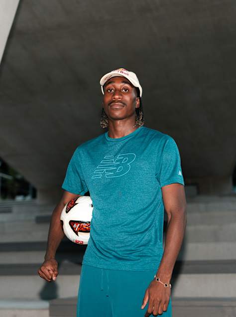 Yan Diomandé poses with a football during a portrait photoshoot in Saalfelden, Austria, in 2026, wearing New Balance apparel.
