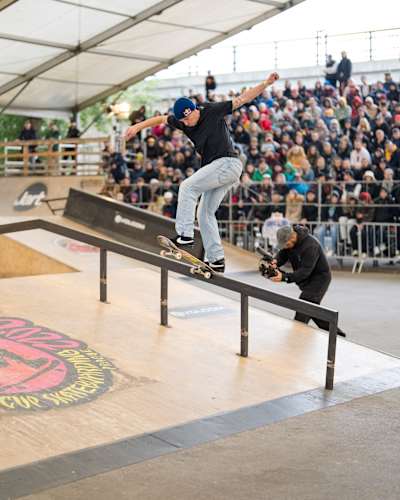Maxim Habanec lands a stylish frontside bluntslide at Red Bull Drop In Tour, Prague, Czech Republic, thrilling the crowd at this high-energy skateboarding event in 2022