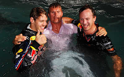A photo of Sebastian Vettel, Christian Horner and David Coulthard in the Red Bull Racing Energy Station swimming pool after the 2011 Monaco Grand Prix.