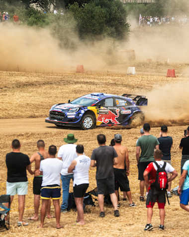 Grégoire Munster of the M-Sport Ford World Rally Team races through dust at the 2025 World Rally Championship Italy in Olbia, thrilling crowds with Red Bull energy