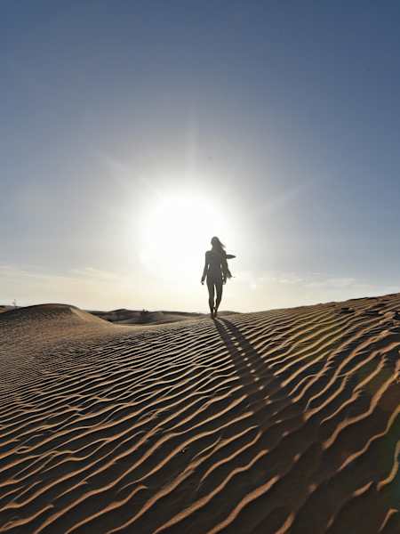 Cassie De Pecol walking the sands of the United Arab Emirates.