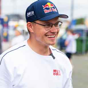 Rokas Baciuška sports the iconic Red Bull cap and shirt at Red Bull Racing Showrun 2025 in Klaipeda, Lithuania, bringing energy and excitement to the motorsport event.