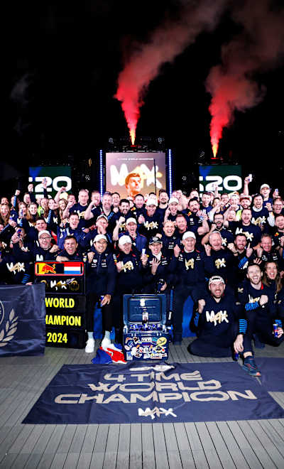 The Oracle Red Bull Racing team celebrate after Max Verstappen of the Netherlands is crowned 2024 F1 World Drivers Champion in the Paddock after the F1 Grand Prix of Las Vegas.