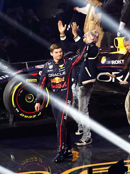 Max Verstappen and Liam Lawson of Oracle Red Bull Racing wave to the crowd from the stage during F1 75 Live at The O2 Arena on February 18, 2025 in London, England.