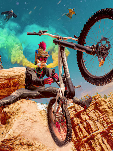 Riders Republic riders perform tricks on mountain bikes off a cavernous jump