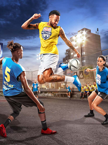 Neymar Jr competes against footballers in a street match.