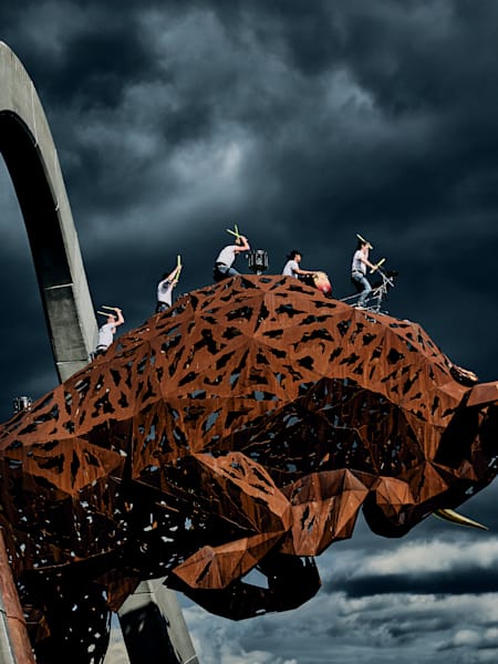 Percussionists beat the giant metal bull sculpture at the Red Bull Ring race track in Spielberg, Austria on June 22, 2020.