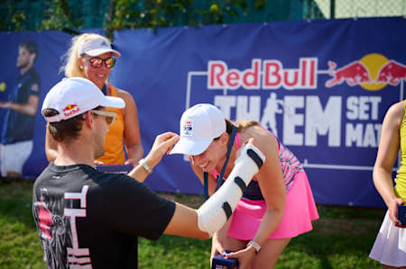 Dominic Thiem awards a medal to Simone Höfferer at Thiem Set Match on August 21, 2021 in Vienna, Austria.