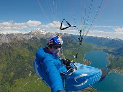 Belgian paraglider Thomas de Dorlodot high above the French mountains in Annecy. 