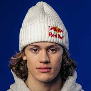 Lucas Braathen, sporting a Red Bull beanie and hoodie, is pictured in a professional portrait taken in Kvitfjell, Norway, on April 3, 2024.