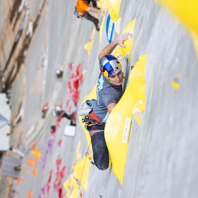 In 2023, Domen Škofic climbs the Red Bull Dual Ascent wall on the Verzasca Dam in Switzerland