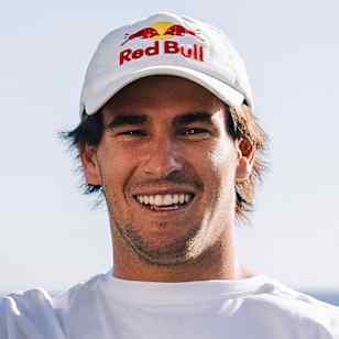 Jack Robinson poses for portrait with surfboard in Red Bull Athlete Zone locker room at Margaret River Pro on 12th April 2024