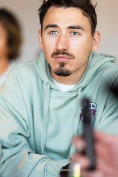 Charles Poujade of France hears a briefing at the Red Bull Ibiza Royale content creator workshop in Salzburg, Austria in 2024.