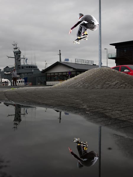 Josh Matthews styles out a drifting ollie in a damp Reykjavik, Iceland.