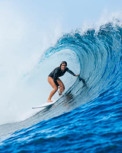 Caroline Marks riding the tube at Teahupo'o, Tahiti.