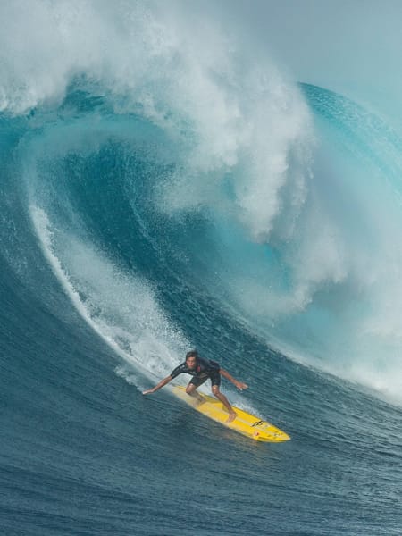 Professional surfer from Kauai, Hawaii, Kai Lenny, drops into a wave at Jaws.