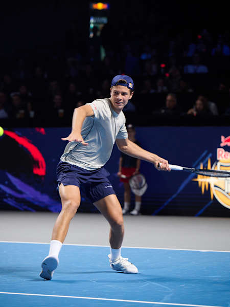 Joël Schwärzler in action at Red Bull Bassline Vienna 2024, with his tennis shot clocked at 233kph