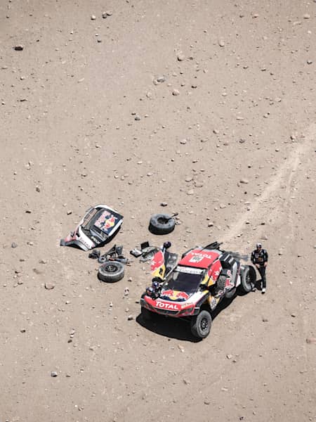 A photo of Cyril Despres and David Castera after crashing during the 2018 Dakar Rally, between San Juan de Marcona and San Juan de Marcona, Peru.