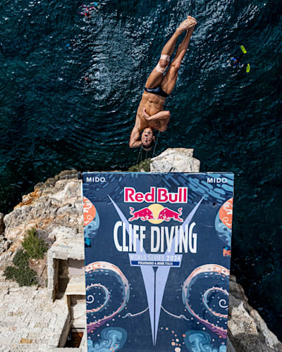 Constantin Popovici of Romania dives during the 2024 Red Bull Cliff Diving World Series in Polignano a Mare, Italy on June 30, 2024. 
