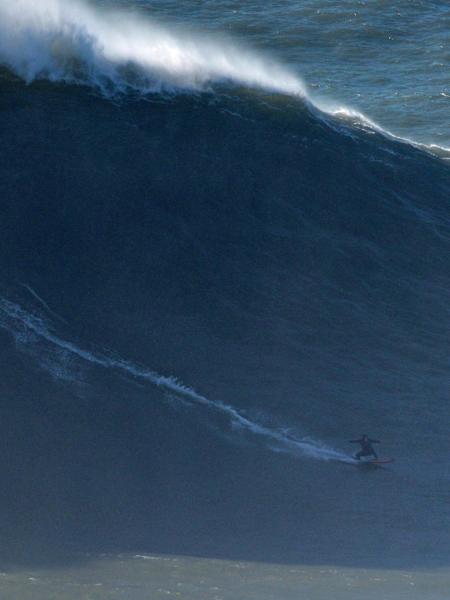 Justine Dupont surfes a big wave in Nazaré, Portugal on November 13, 2019.