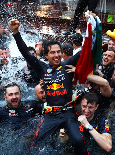 Race winner Sergio Perez celebrates with his team by jumping into the pool after the F1 Grand Prix of Monaco at Circuit de Monaco on May 29, 2022 in Monte-Carlo, Monaco. 