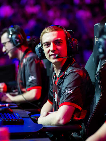 A portrait of gaming pro Caps in action at a competition