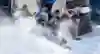Red Bull Crashed Ice competitors fight for position through a corner in Saint Paul, USA.