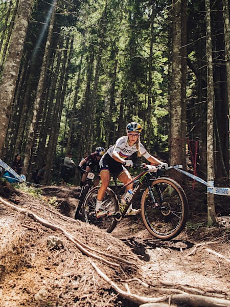 Pauline Ferrand-Prevot and Laura Stigger ride during the UCI XCO World Cup in Leogang, Austria on June 13, 2021.