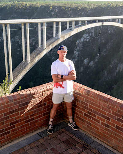 Obstacle course athlete Thomas van Tonder stands in front of Bloukrans Bridge as he prepares for a world-first challenge, tackling 600 monkey bars attached to South Africa’s highest bridge. 