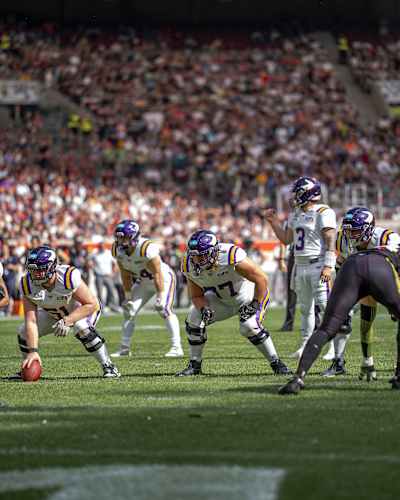 Vienna Vikings and Stuttgart Surge players, in the American Football League Europe, crouched face-to-face before the snap