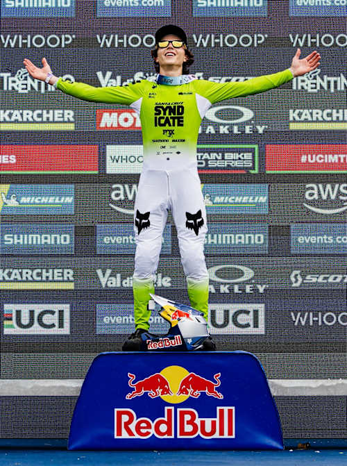 Jackson Goldstone stands triumphant atop the podium at the UCI Mountain Bike World Cup in Val di Sole, Italy, on June 20, 2025.
