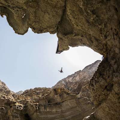 On 26 September 2012, Michal Navratil launches from a 27.5-metre platform at Wadi Shab, Sur, Oman, during the dramatic final of the Red Bull Cliff Diving World Series