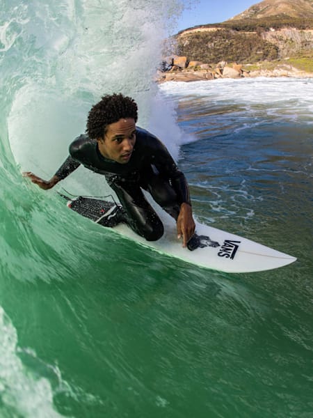 Professional surfer from South Africa, Michael February, pulls into a barrel while surfing in Cape Town.