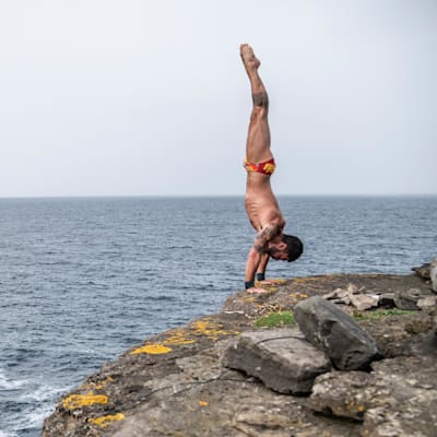 Carlos Gimeno prepares to dive at the fourth stop of the Red Bull Cliff Diving World Series in Downpatrick Head, Ireland, on September 10, 2021.