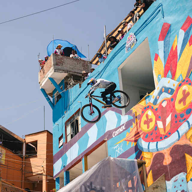 Pedro Burns cycles out of an upper floor of a building during Red Bull Cerro Abajo Guanajuato in Guanajuato, Mexico, on March 23, 2024