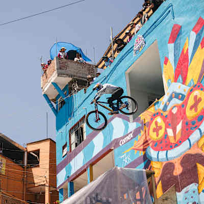 Pedro Burns cycles out of an upper floor of a building during Red Bull Cerro Abajo Guanajuato in Guanajuato, Mexico, on March 23, 2024