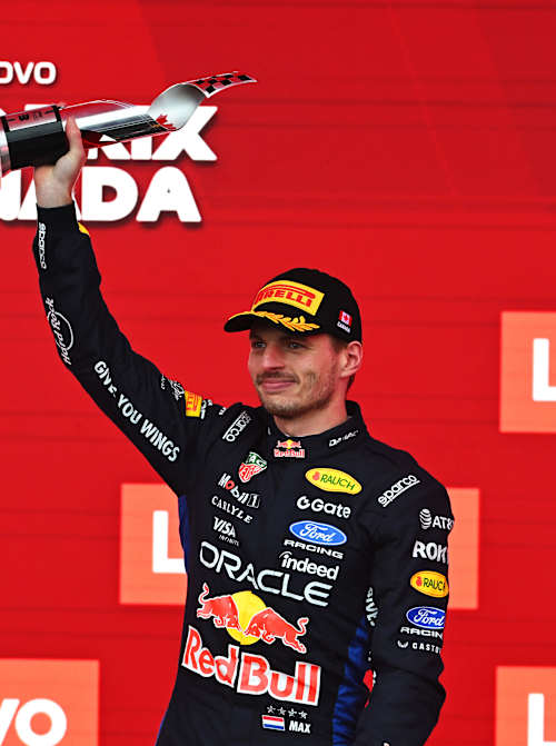 Max Verstappen lifts his trophy on the podium after the F1 Grand Prix of Canada in May 2026 in Montreal, Quebec.