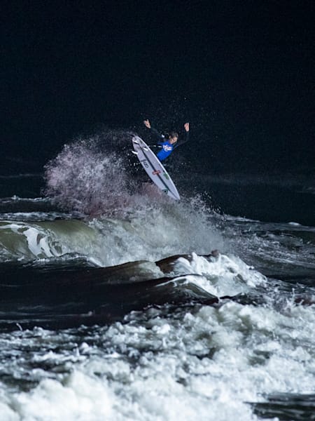 Eric Geiselman competes during Red Bull Night Riders surf competition