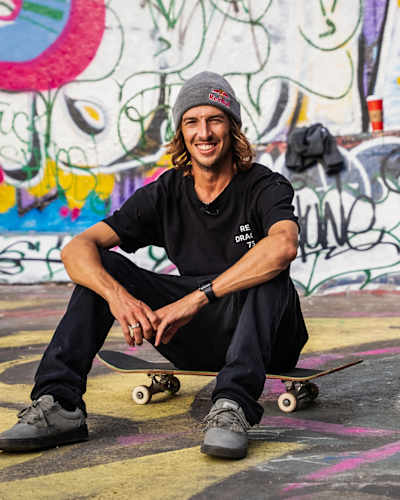 Ryan Decenzo poses on his skateboard.