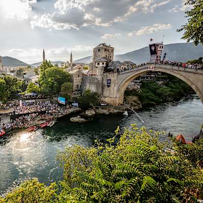 Pierrick Schafer of Switzerland dives from the 27.5-metre platform on Stari Most in Mostar during the 2026 Red Bull Cliff Diving World Series final competition day